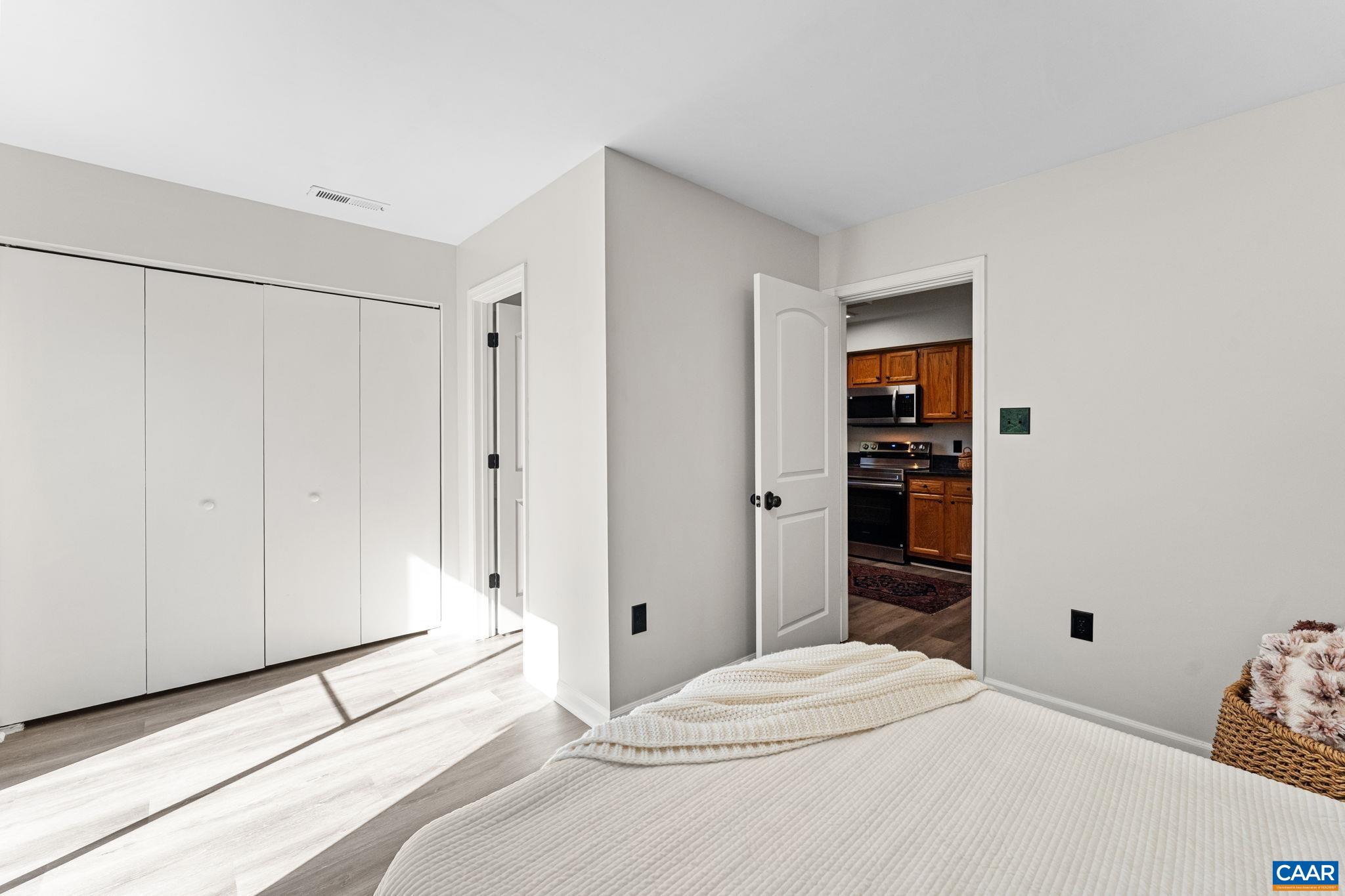 403 Riverside Avenue Charlottesville, VA 22902 - Photo 14 of 27 a bedroom with a bed and a closet