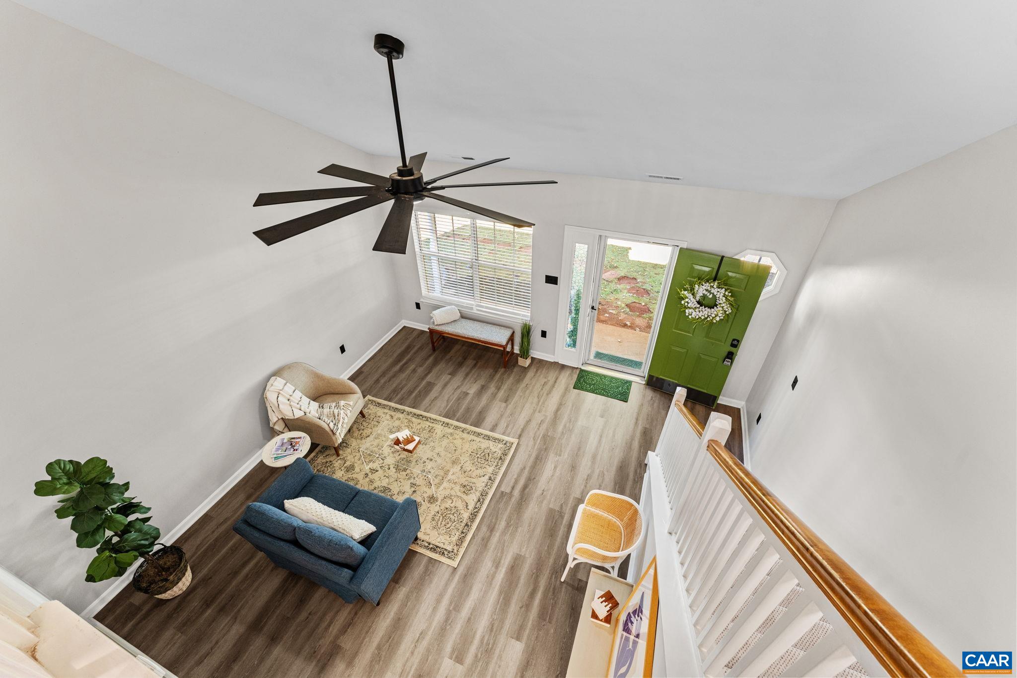 403 Riverside Avenue Charlottesville, VA 22902 - Photo 16 of 27 a living room with furniture and a wooden floor