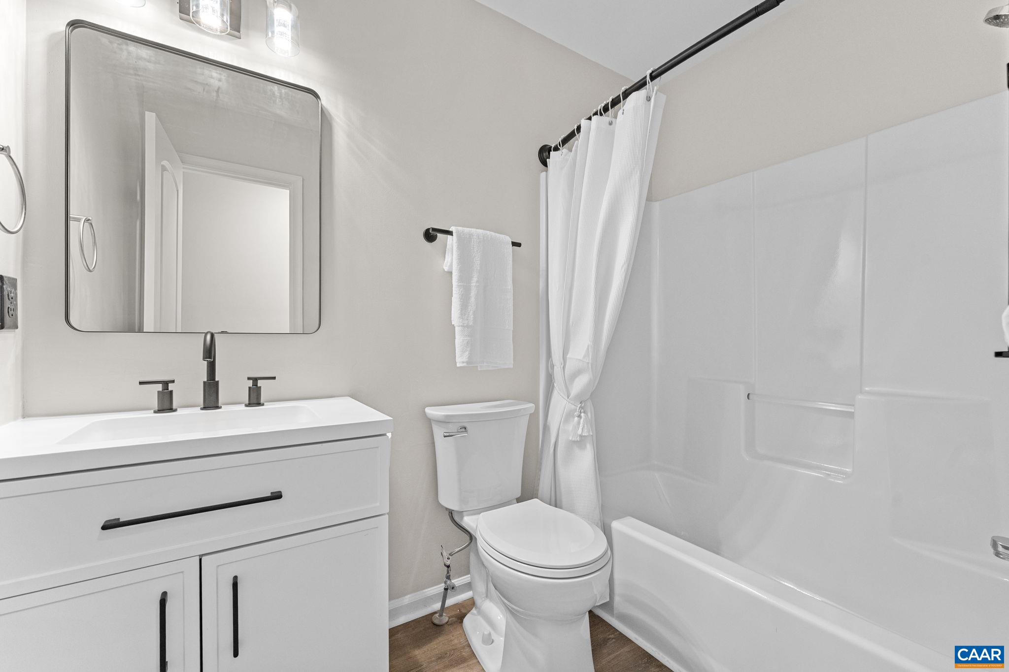 403 Riverside Avenue Charlottesville, VA 22902 - Photo 18 of 27 a bathroom with a sink toilet vanity and shower
