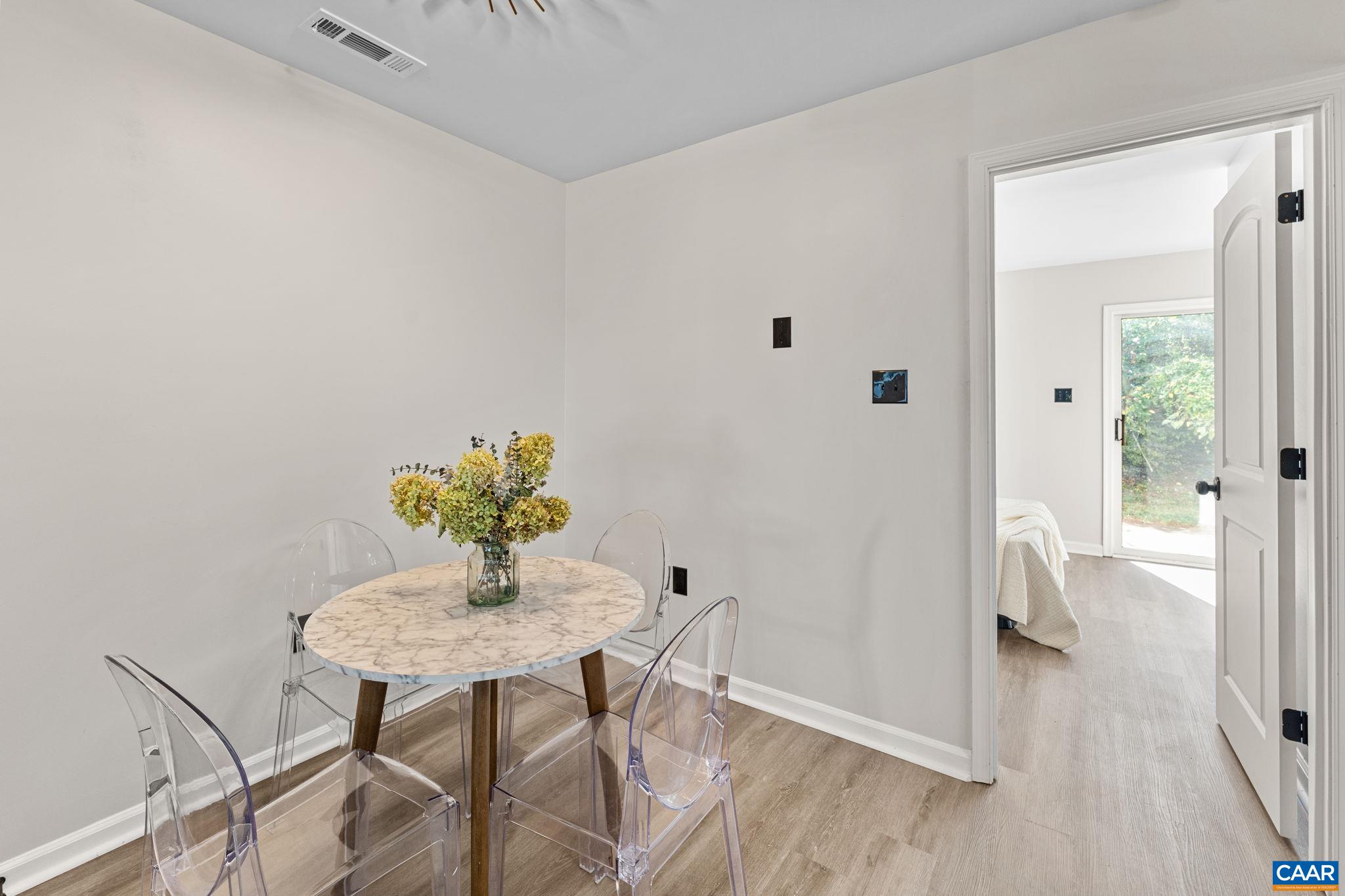 403 Riverside Avenue Charlottesville, VA 22902 - Photo 8 of 27 a view of a dining room with furniture window and wooden floor