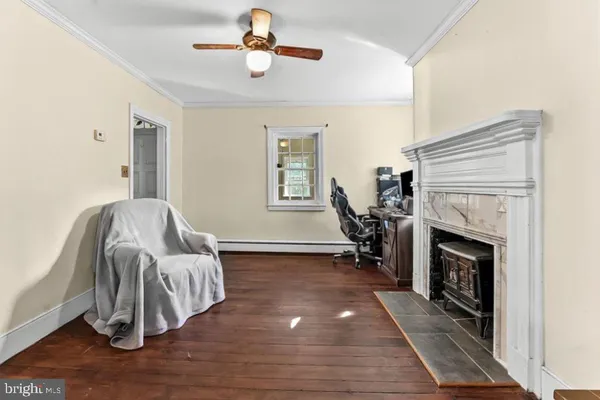 a living room with furniture and a fireplace