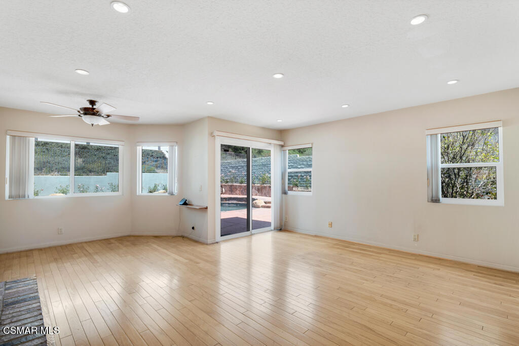 5339 Seneca Place Simi Valley, CA 93063 - Photo 30 of 76 a view of an empty room with wooden floor and a window