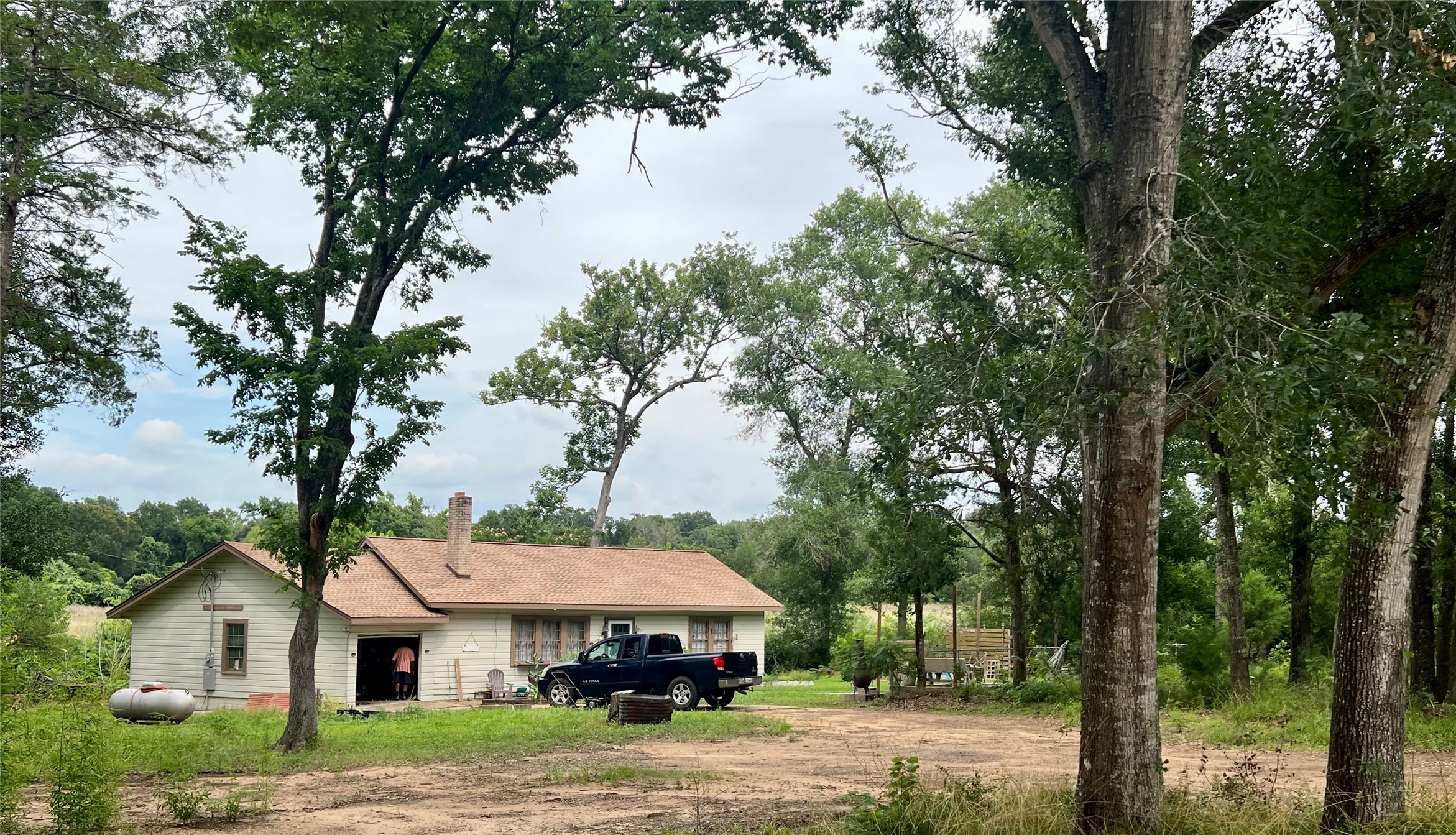 22606 Farm To Market 359 Hempstead, TX 77445 - Photo 17 of 26 a house with trees in the background