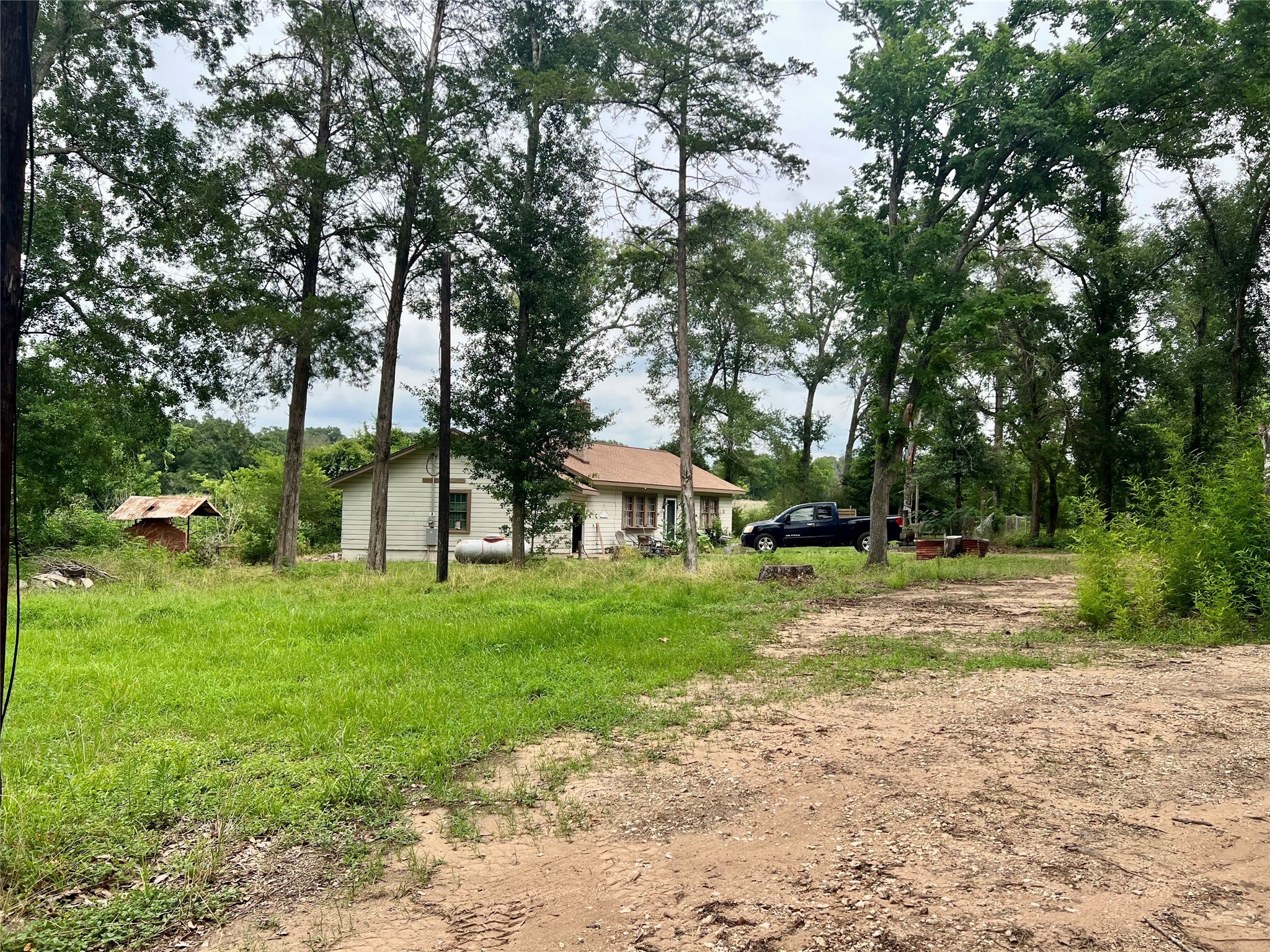 22606 Farm To Market 359 Hempstead, TX 77445 - Photo 18 of 26 a view of a house with a yard