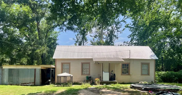 a front view of a house with yard