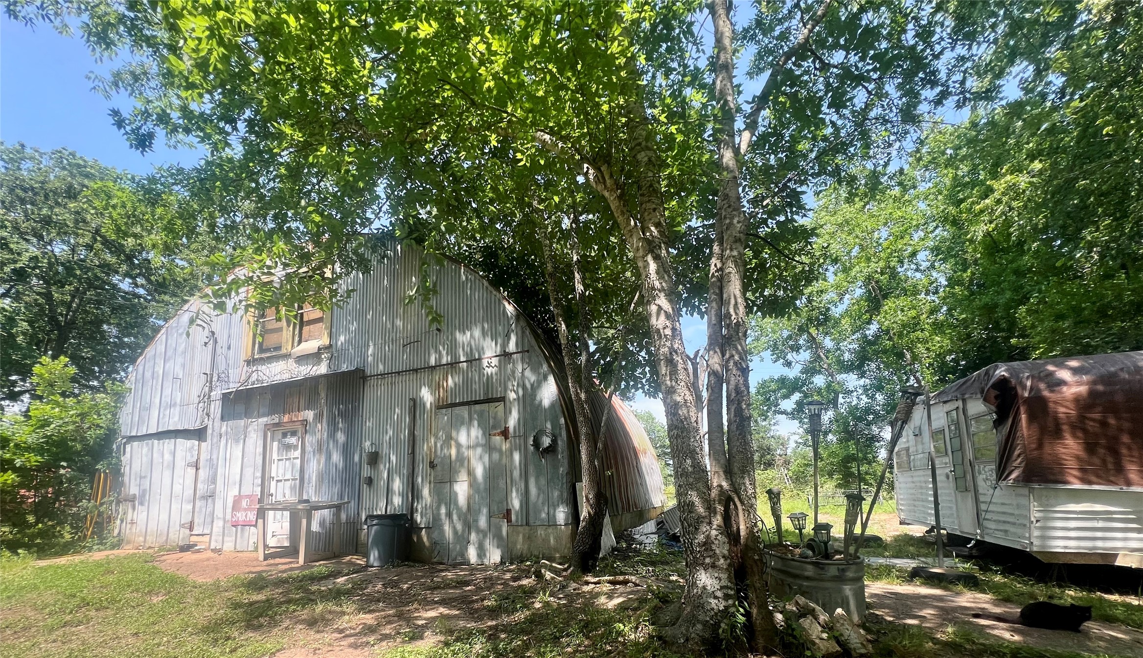 22606 Farm To Market 359 Hempstead, TX 77445 - Photo 24 of 26 a backyard of a house with barbeque oven