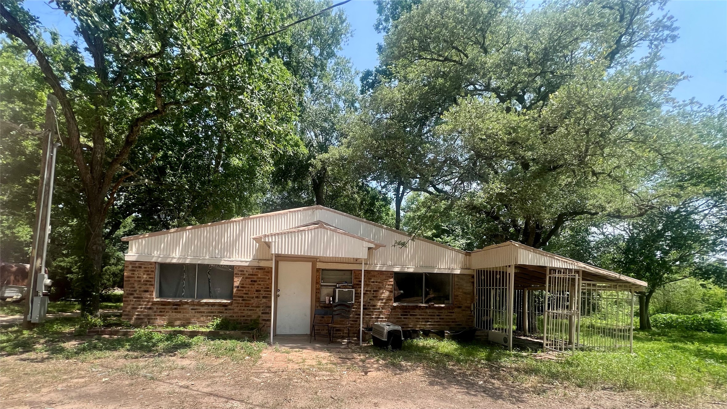 22606 Farm To Market 359 Hempstead, TX 77445 - Photo 3 of 26 a view of a small house with a sink and backyard