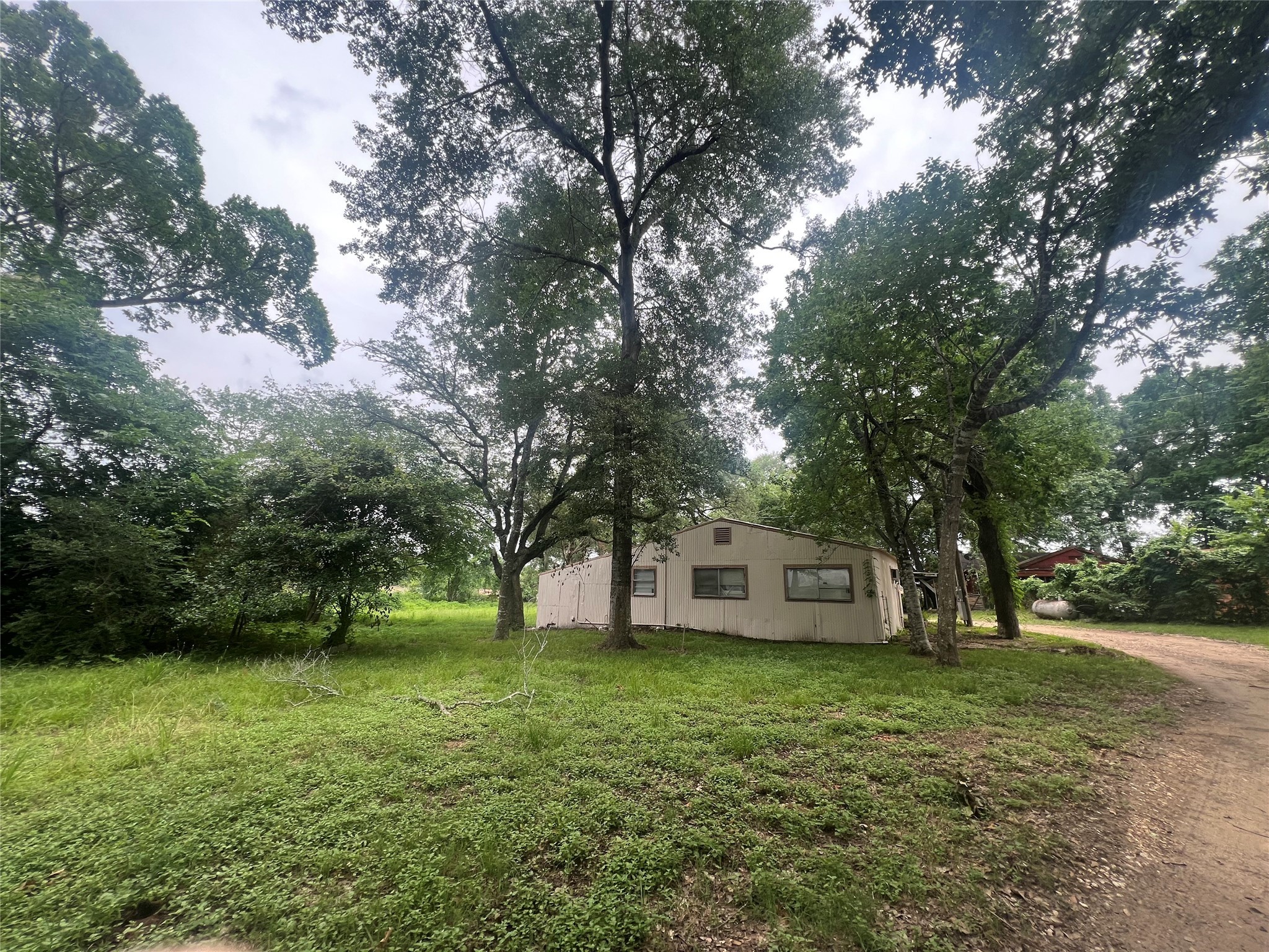 22606 Farm To Market 359 Hempstead, TX 77445 - Photo 6 of 26 a view of house with backyard
