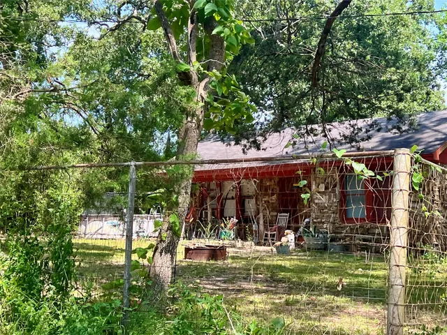 a view of a chairs and table in a patio