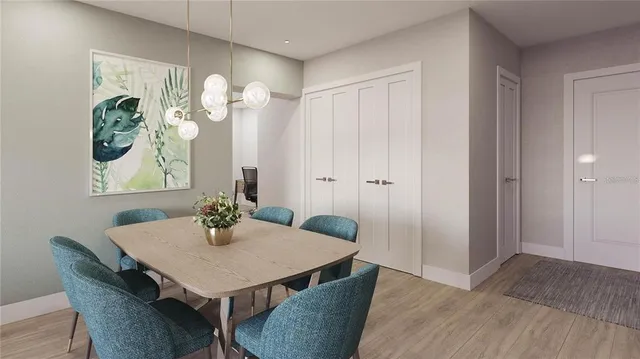 a view of a dining room with furniture and wooden floor