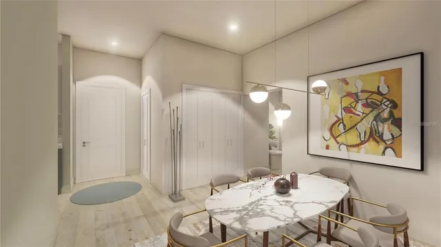 a view of a very nice looking dining room with a table and chairs