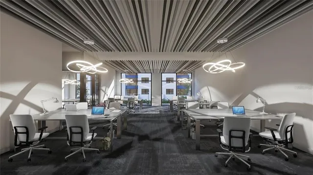 a view of a dining room with furniture wooden floor and chandelier