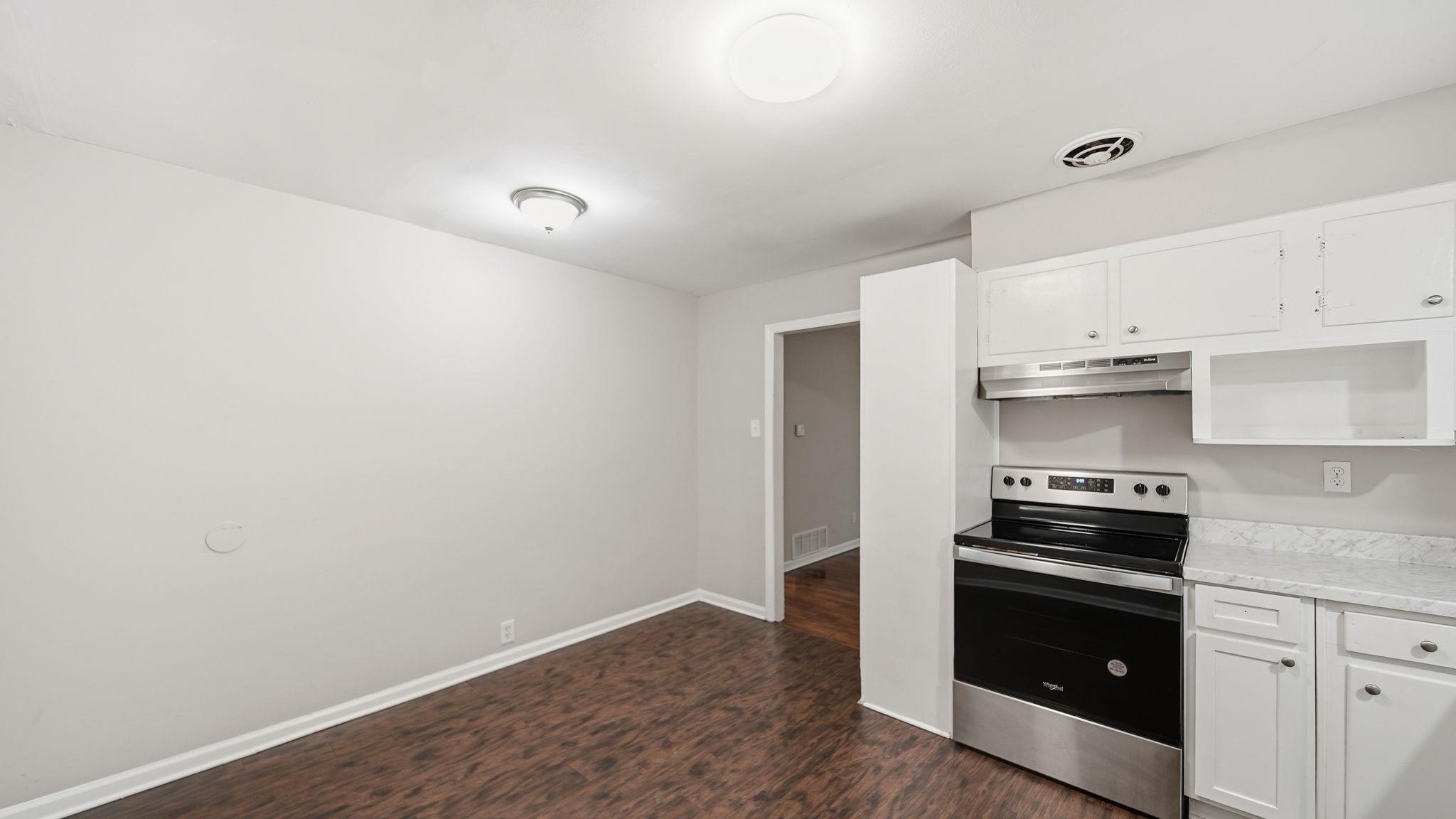 3531 Randolph Street Memphis, TN 38127 - Photo 11 of 32 a kitchen with granite countertop a stove and a sink