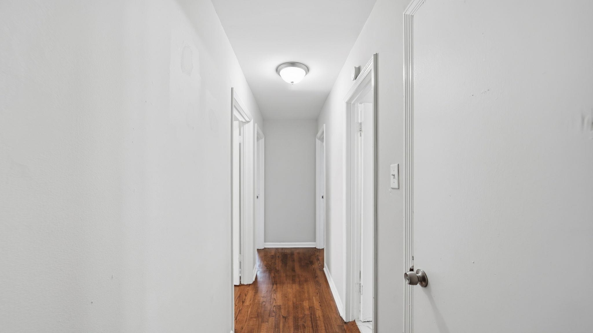 3531 Randolph Street Memphis, TN 38127 - Photo 16 of 32 a view of a hallway with wooden floor