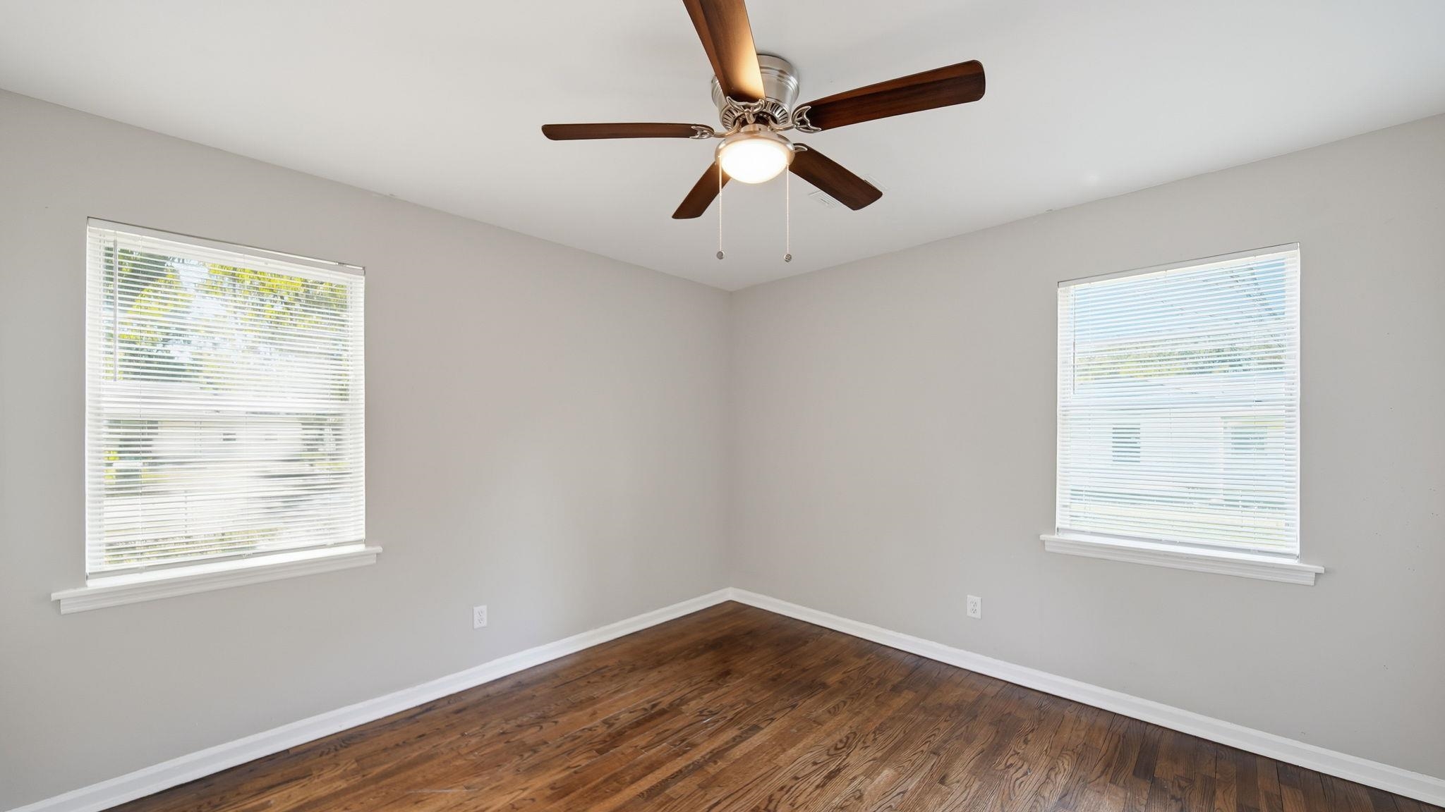 3531 Randolph Street Memphis, TN 38127 - Photo 20 of 32 a view of an empty room with wooden floor and a window