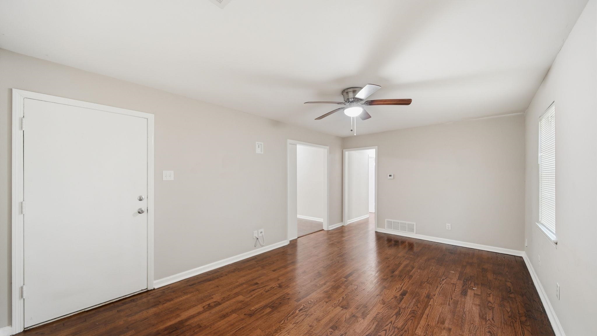 3531 Randolph Street Memphis, TN 38127 - Photo 27 of 32 wooden floor in an empty room with a window
