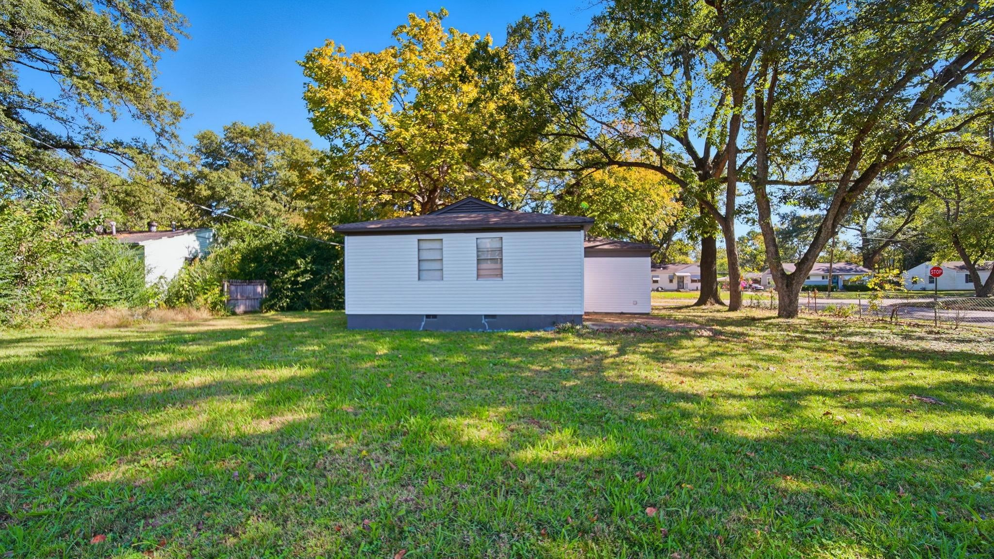 3531 Randolph Street Memphis, TN 38127 - Photo 28 of 32 a view of a backyard with large trees