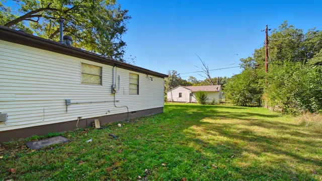 a view of a backyard with a garden