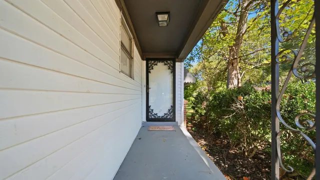 a view of a pathway besides a house