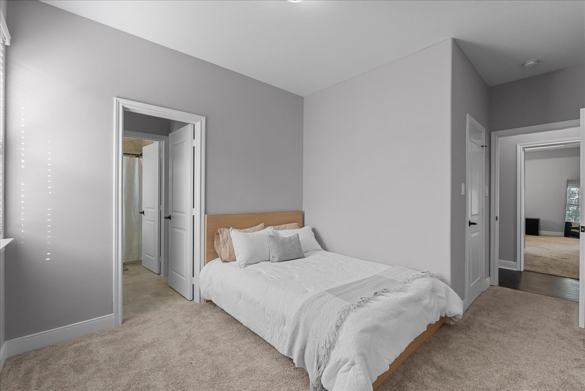 20061 Torrey Pines Lane Cleveland, TX 77327 - Photo 21 of 41 a bedroom with a bed and closet