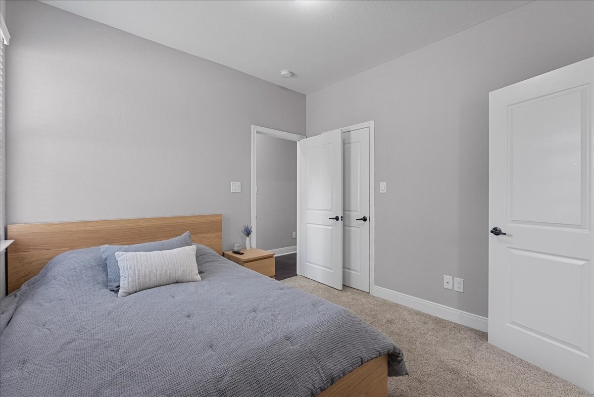 20061 Torrey Pines Lane Cleveland, TX 77327 - Photo 23 of 41 a bedroom with a bed and closet