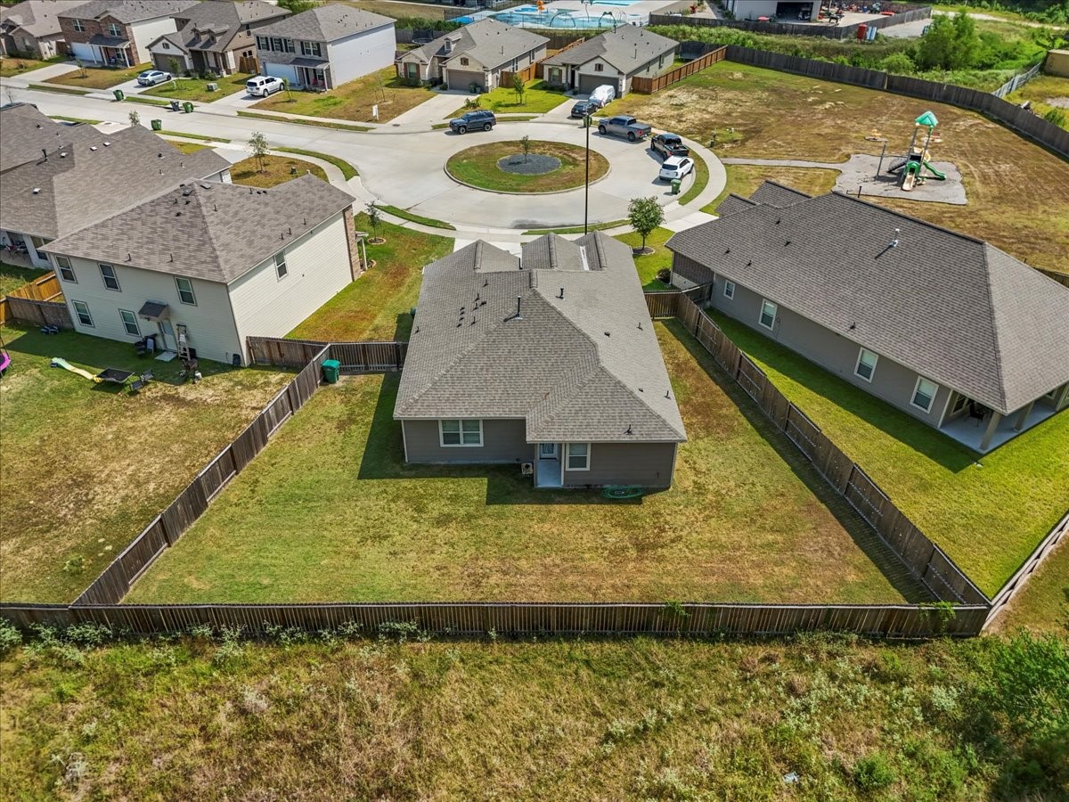 20061 Torrey Pines Lane Cleveland, TX 77327 - Photo 36 of 41 swimming pool view with a backyard space