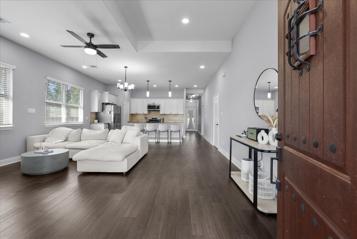20061 Torrey Pines Lane Cleveland, TX 77327 - Photo 4 of 41 a living room with furniture and a wooden floor