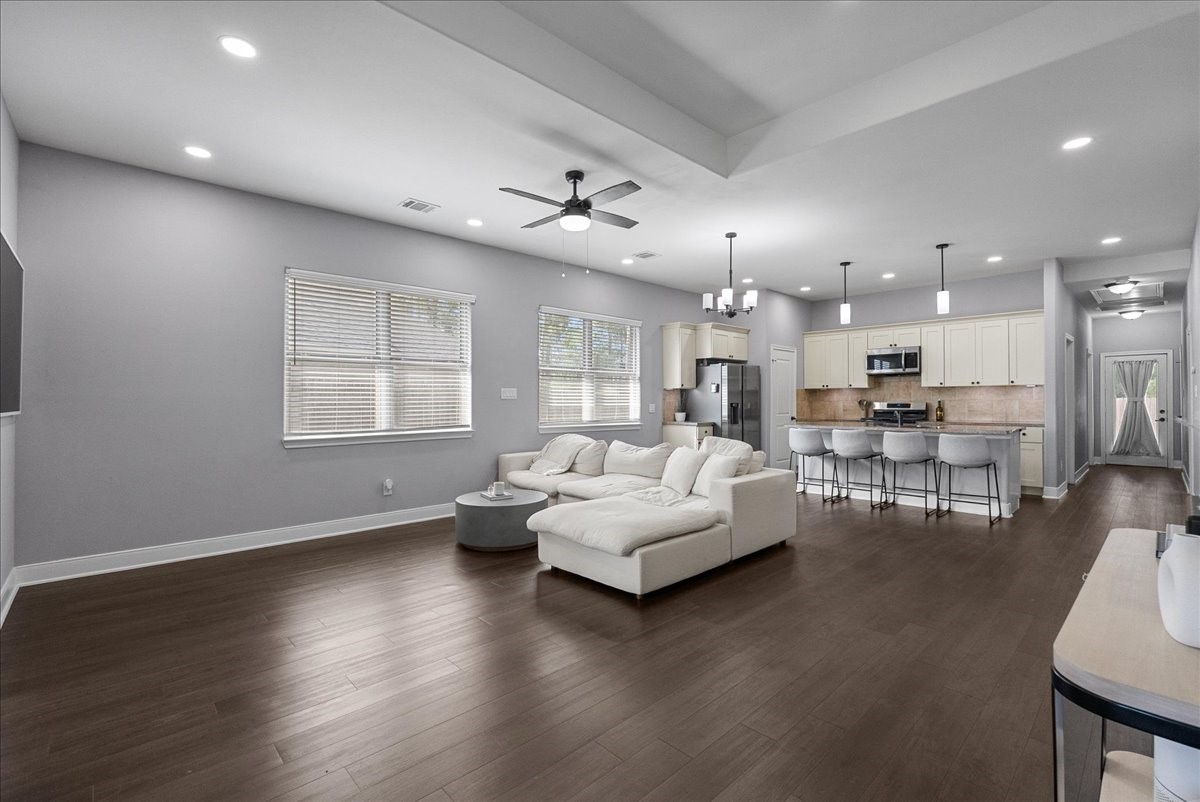 20061 Torrey Pines Lane Cleveland, TX 77327 - Photo 5 of 41 a living room with furniture and a wooden floor