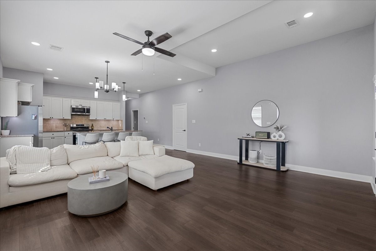 20061 Torrey Pines Lane Cleveland, TX 77327 - Photo 6 of 41 a living room with furniture and a wooden floor