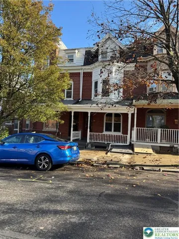 front view of a house with a street