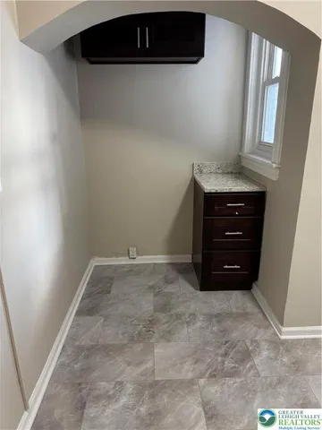 a room with a cabinets and a wooden floor