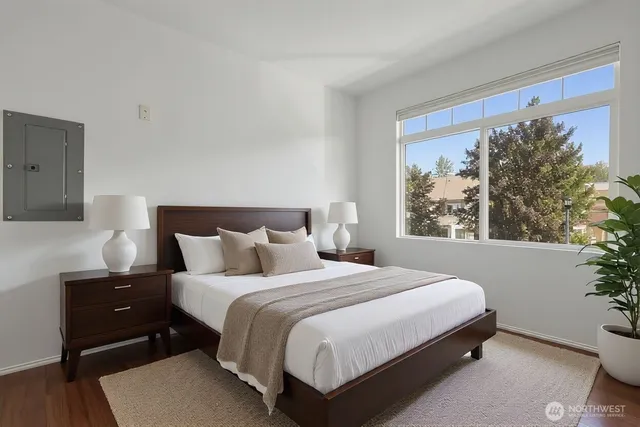 a bedroom with a bed and a window