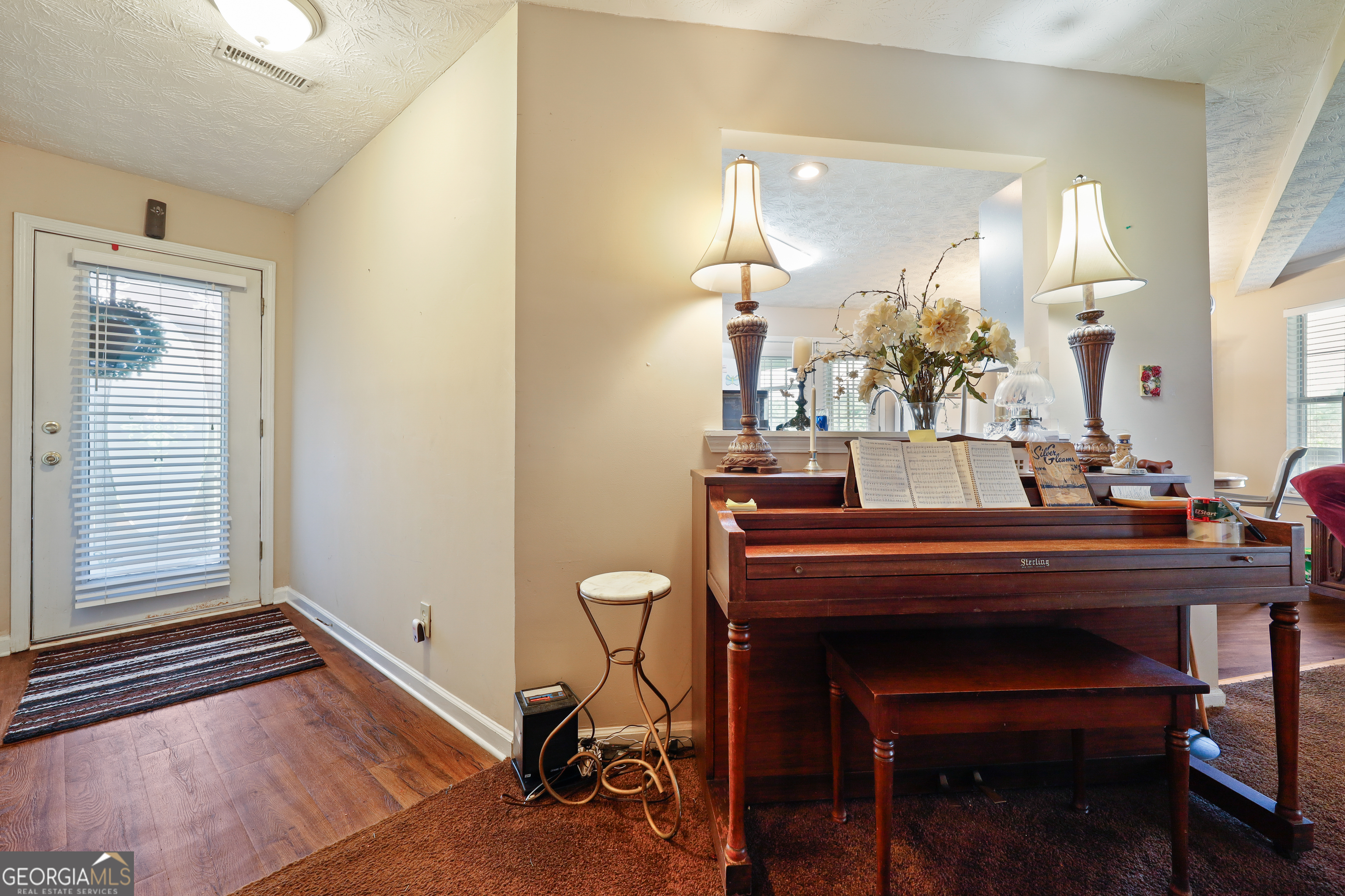 2433 Bear Creek Road Statham, GA 30666 - Photo 16 of 58 a view of a room with a table and chairs