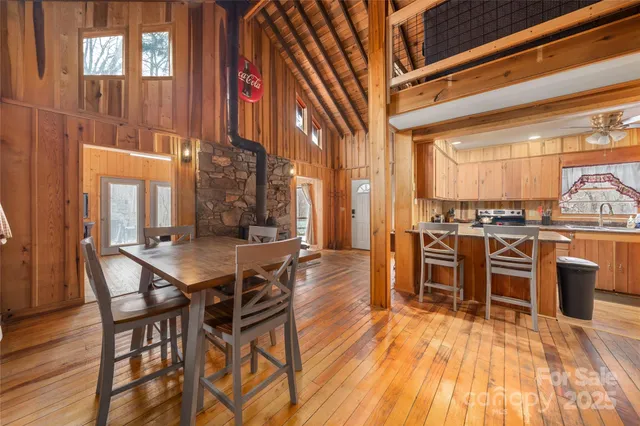 a dining room with furniture and wooden floor