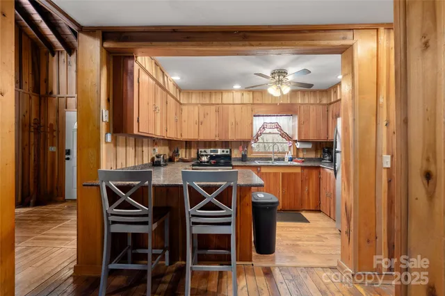 a kitchen with a table and chairs in it