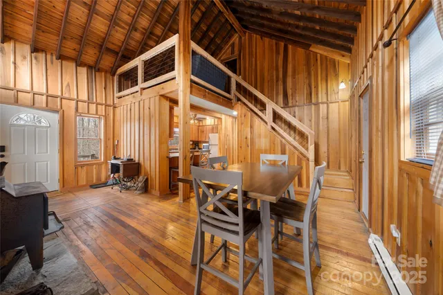 a view of an entryway with wooden floor and door