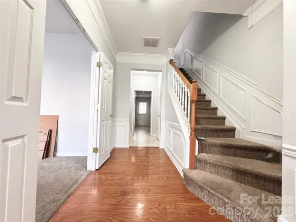 a view of a hallway view with staircase