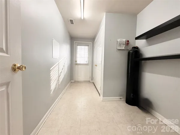 a view of a hallway with windows