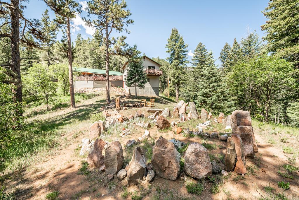 9600 Middle Creek Canyon Road Beulah, CO 81023 - Photo 50 of 50 a backyard of a house with table and chairs