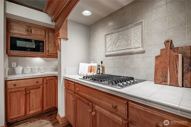 a kitchen with a stove and cabinets