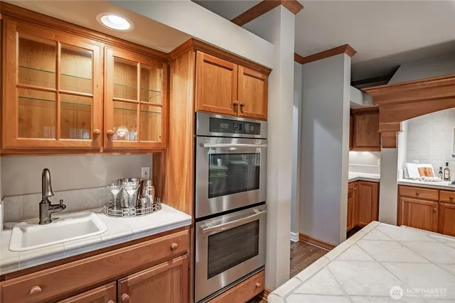 a kitchen with a refrigerator and a sink