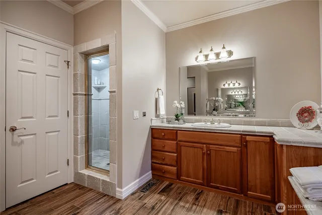 a bathroom with a double vanity sink and a mirror