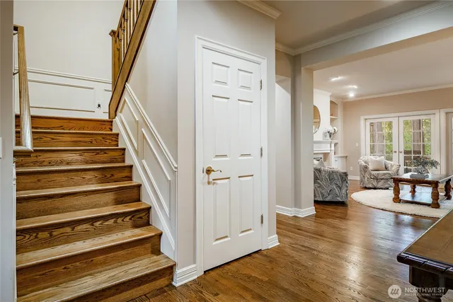 a view of an entryway with wooden floor and windows