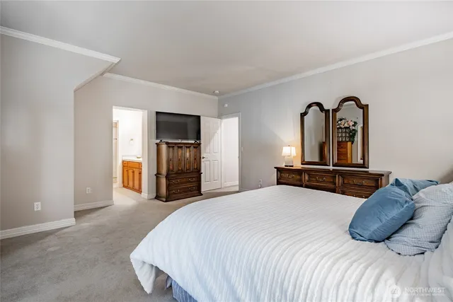 a bedroom with a bed and dresser