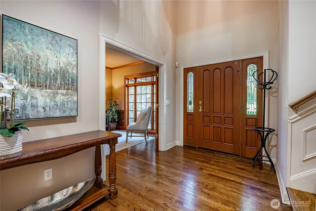 a room with wooden floor and furniture