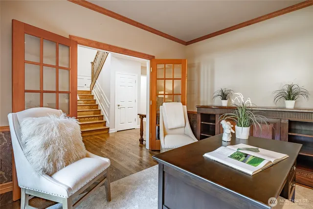 a living room with furniture and next to a window
