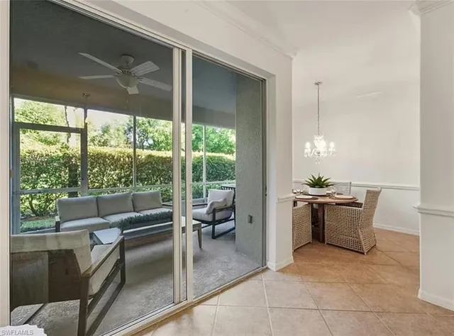 a kitchen with kitchen island a large window in it