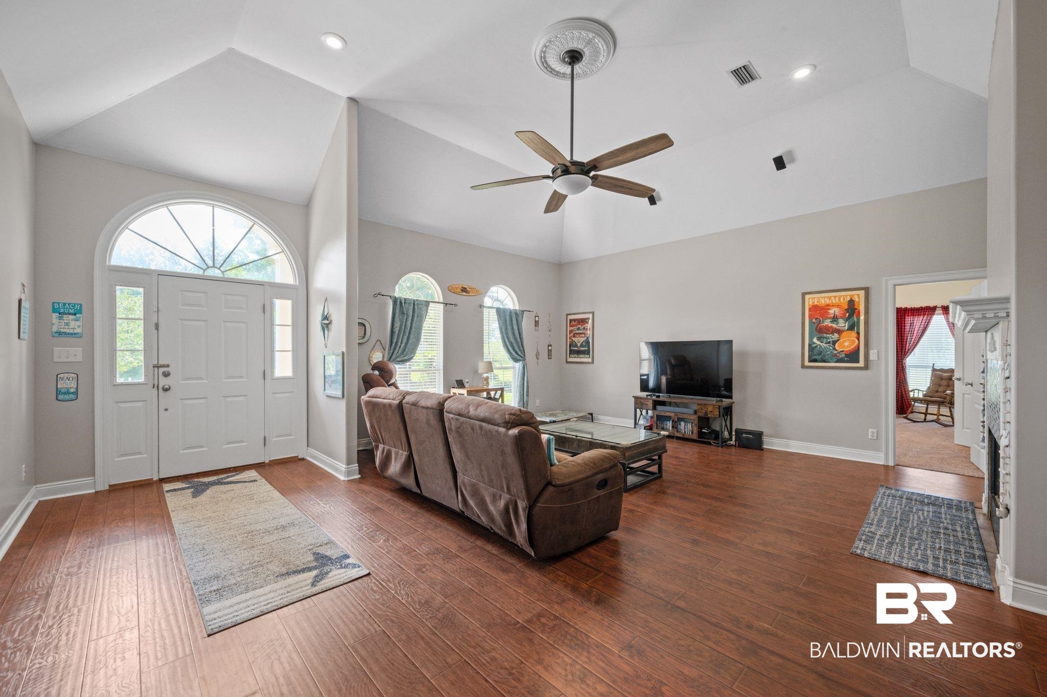 48513 Phillipsville Road Bay Minette, AL 36507 - Photo 8 of 50 Living room with high vaulted ceiling, dark wood-style floors, a ceiling fan, and plenty of natural light