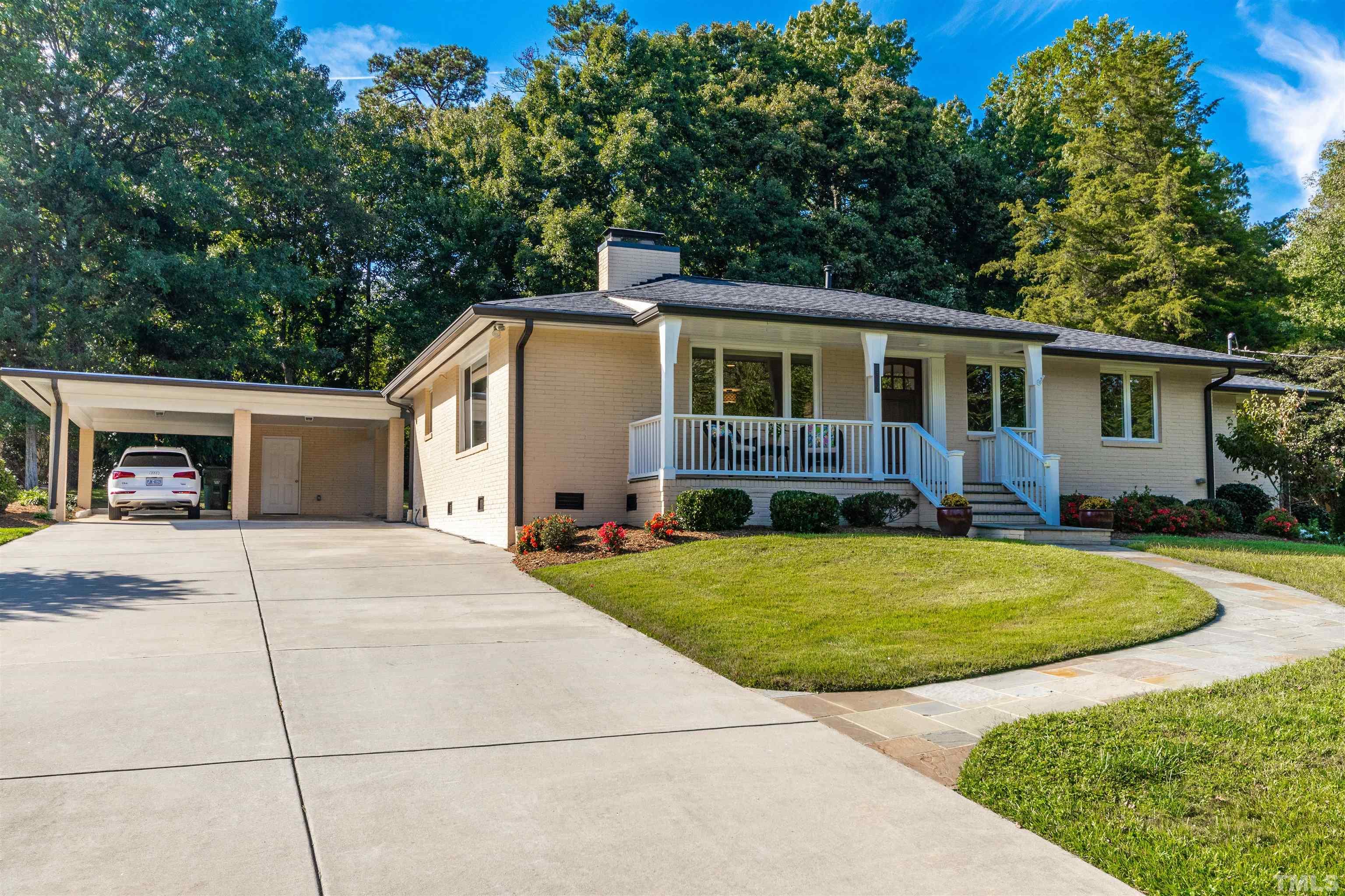 1509 Lutz Avenue Raleigh, NC 27607 - Photo 1 of 30 a view of an house with backyard and trees