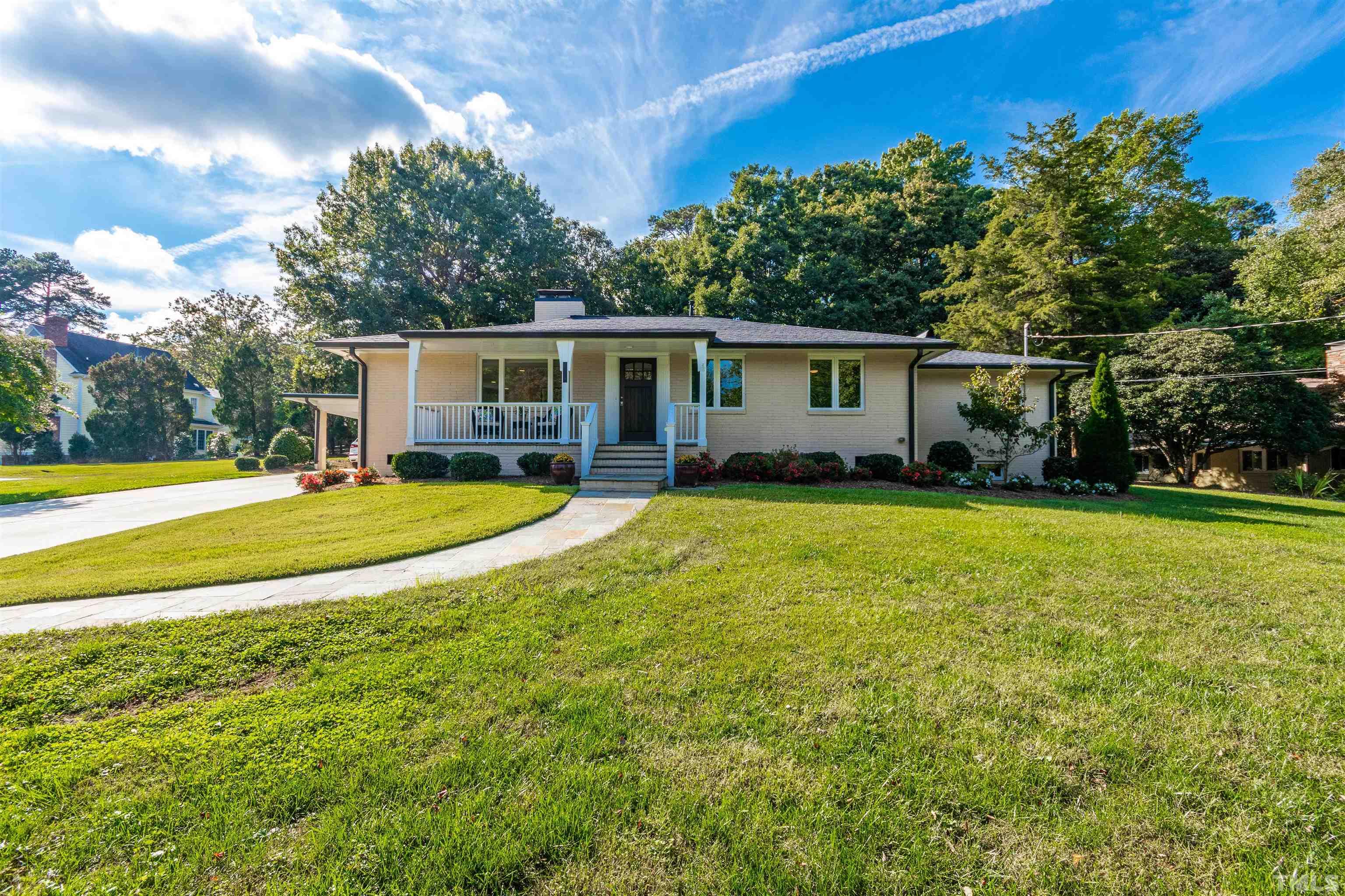 1509 Lutz Avenue Raleigh, NC 27607 - Photo 2 of 30 a view of a house with a big yard